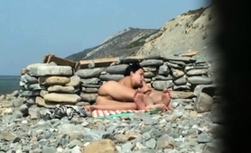 hot-milf-caught-enjoying-a-hard-pussy-fucking-on-the-beach