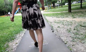Crossdresser in stockings goes out for a walk with camera